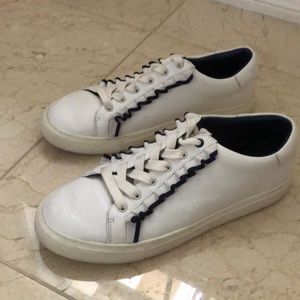 Tory Burch leather sneaker with navy blue ruffle